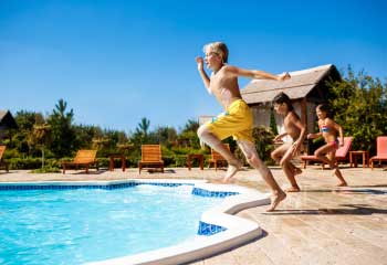 cheerful-children-rejoicing-jumping-swimming-pool-1