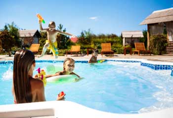 cheerful-children-rejoicing-jumping-swimming-pool cheerful-children-rejoicing-jumping-swimming-pool