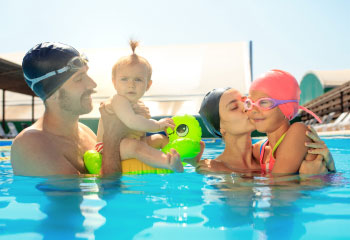 happy-family-having-fun-by-swimming-pool-2 happy-family-having-fun-by-swimming-pool-2